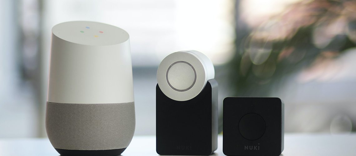white and gray Google smart speaker and two black speakers - One of the Smart Home Devices