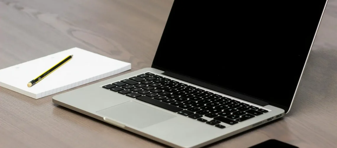 Free Silver Macbook Beside Iphone Stock Photo